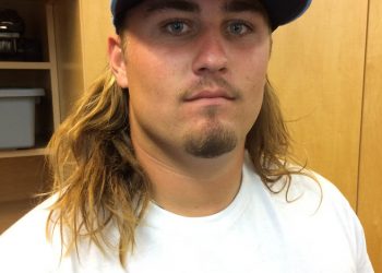 Surfers carry out ocean pollution awareness with paddle around Ocean Beach Pier