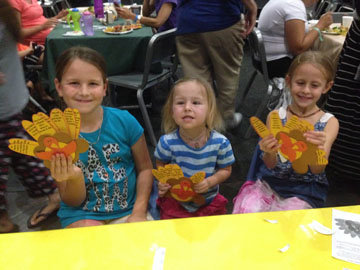 LJ president of Altrusa Int. Club of SD, Charlotte Perry, brings Thanksgiving joy to kids at The Ronald McDonald House Harvest Party