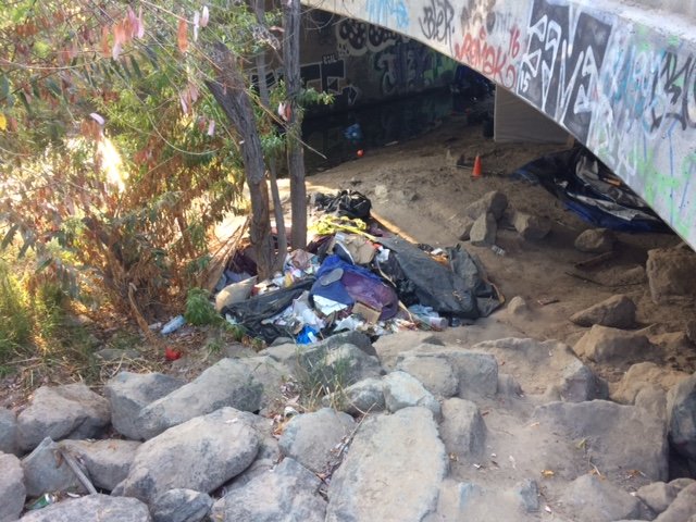 City cleans up riverbed, offers services to homeless living there