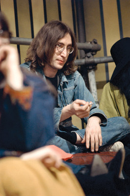 Stones bassist hits high note with photos