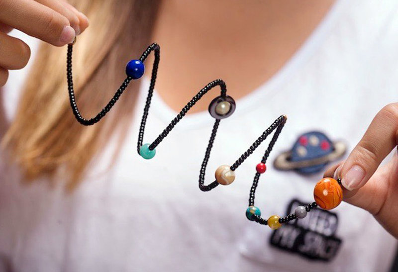 Mission Beach entrepreneur wraps the solar system around wrists of San Diegans