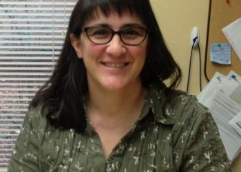 University Community library chief drives a new Buick