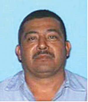 Hunt on for suspected killer of beloved auto-shop owner