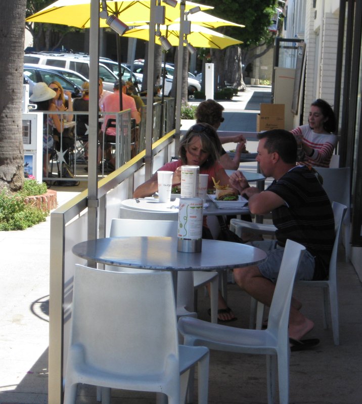 Village's sidewalk cafés are a seat of contention