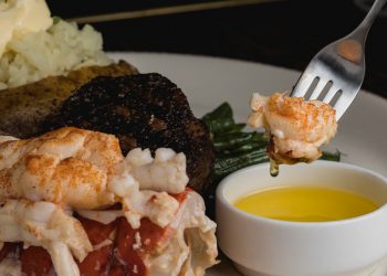 Mobile barber shop goes with the flow for beach cuts