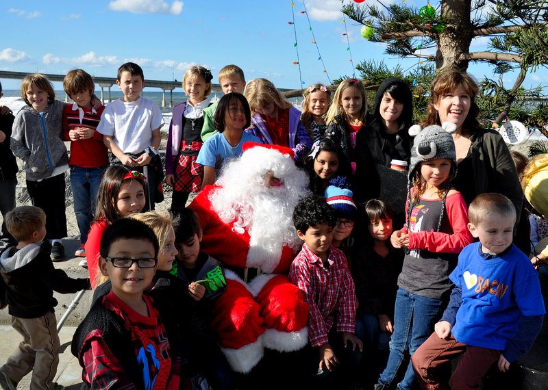 Schoolchildren get early visit from Santa under OB’s community Christmas tree