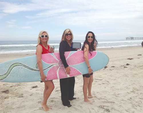 Surf Divas stay connected in the surf
