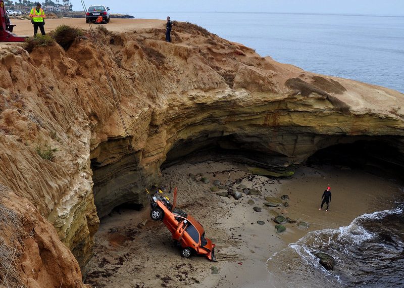 Man survives after car plunges 45 feet over cliffs
