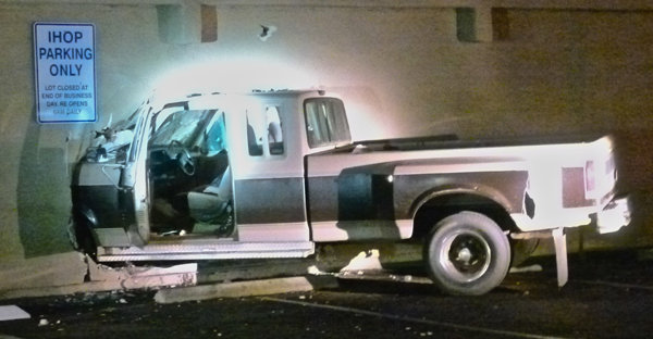 Driver plows through Midway motel wall