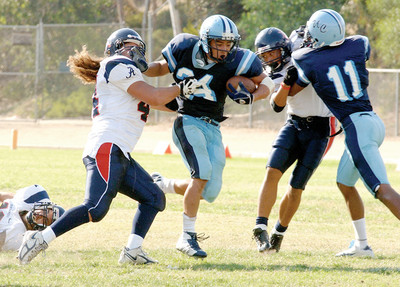 Gridders tackle split results in openers