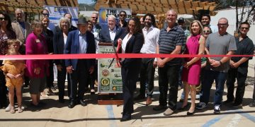 thumbnail executive director dr. julie hayden cuts the ribbon for genesis recovery's reopening