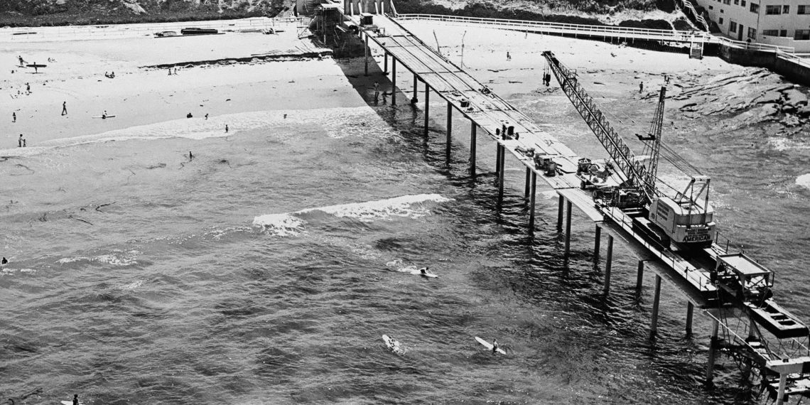 r1 arial of crane on pier